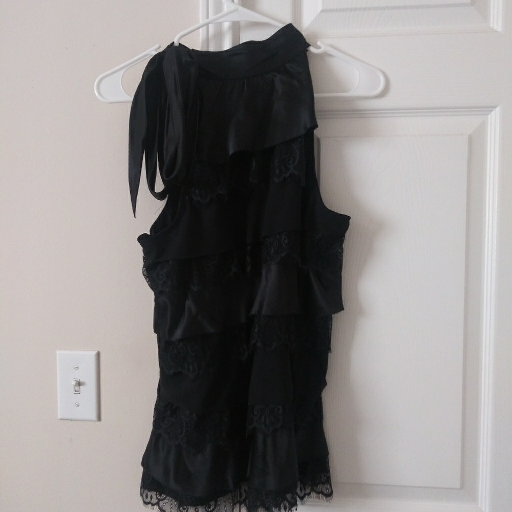 Black sleeveless turtleneck blouse